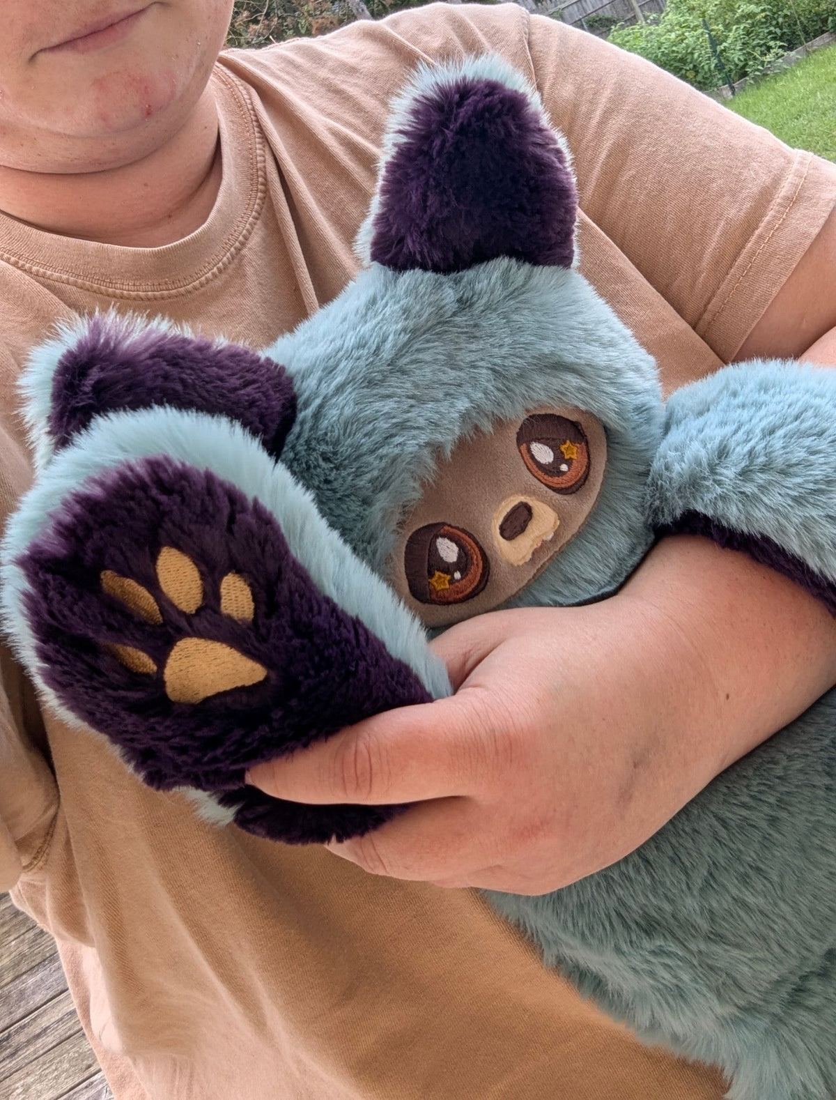 Evvies Lovies Jasper Noodle Wolf Pup plush with teal and plum faux fur, amber eyes, and gold embroidered toe beans.