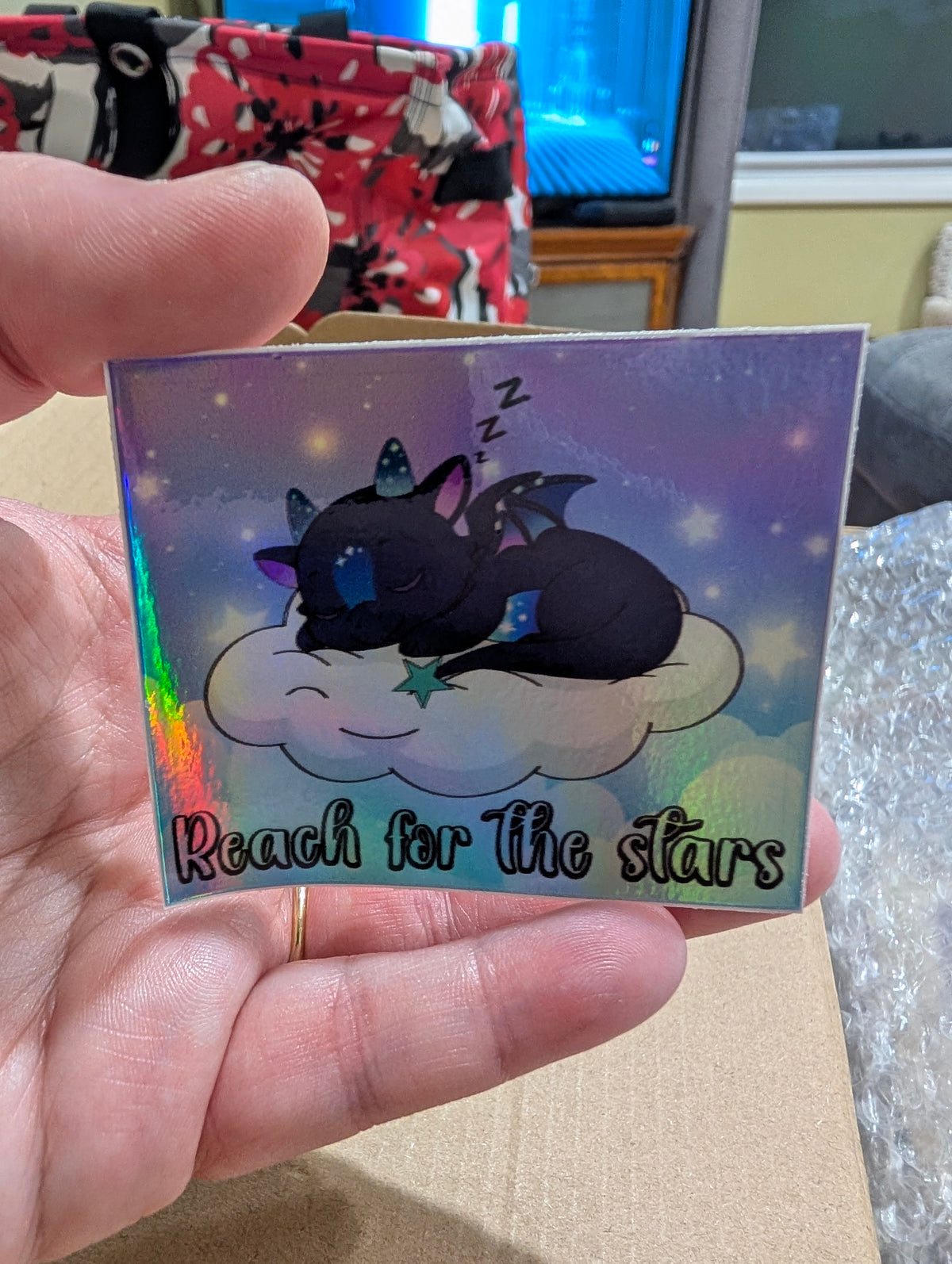 Norrhys Reach for the Stars holographic sticker shimmering in rainbow colors